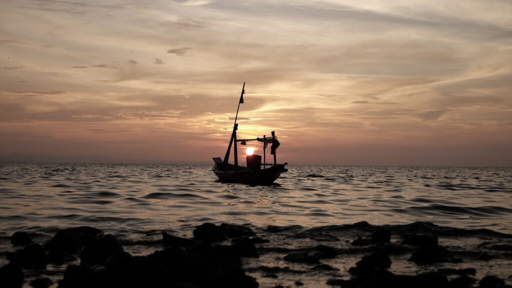 Fishing boat near offshore oil rig