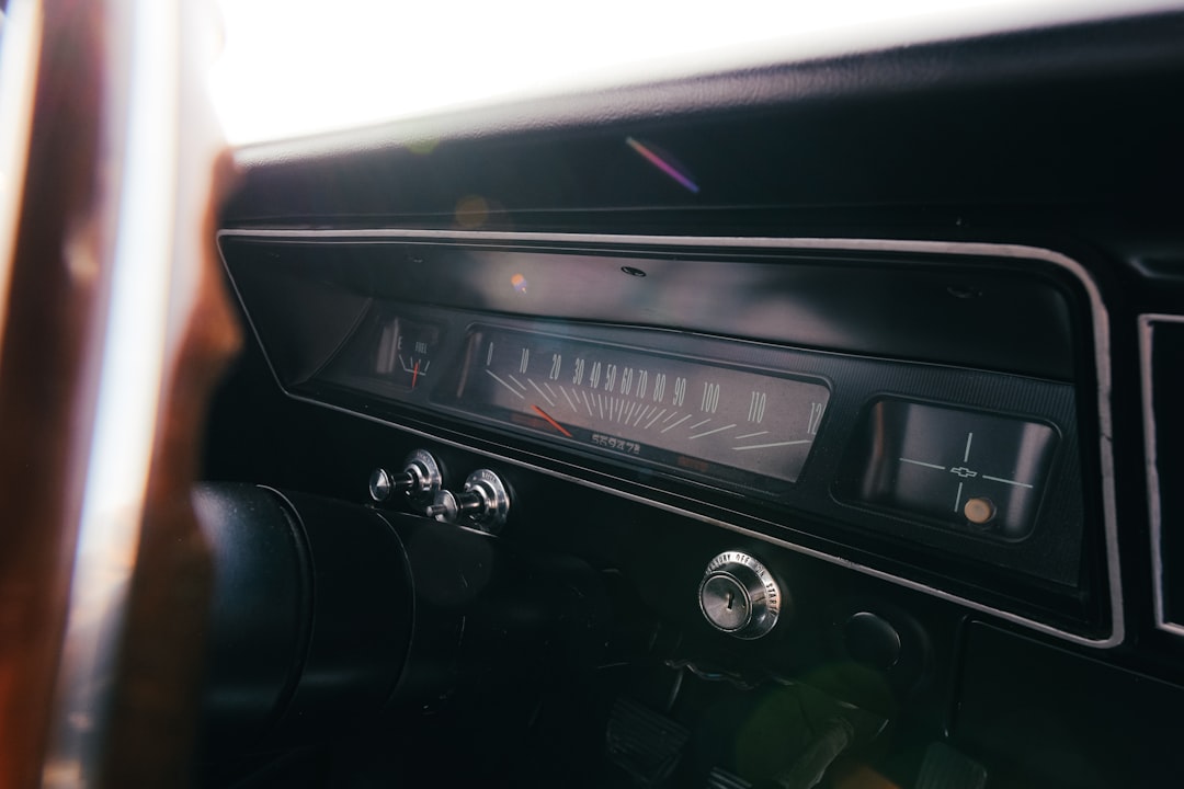 A close-up shot of a modern boat's high-tech dashboard, showing a glowing GPS navigation screen and other electronic instruments.